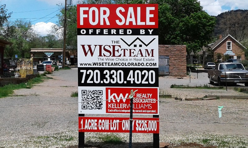 The Wise Team Real Estate panel sign